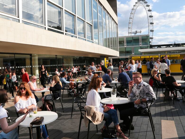 People enjoying the Riverside Terrace