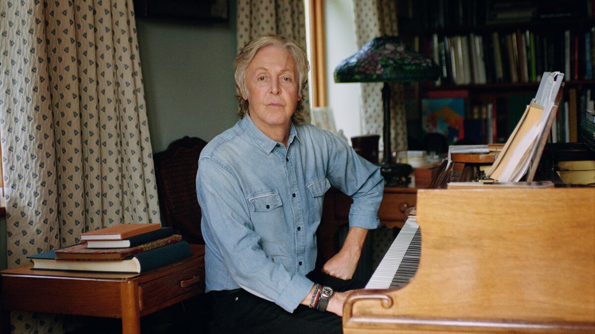 Paul McCartney, artist, pictured by a piano