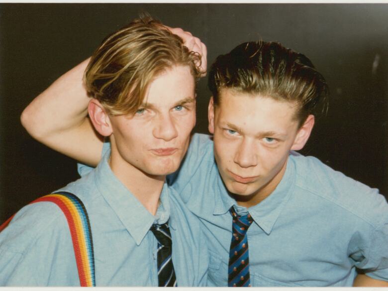 Two young men pose for a photograph at Pride '87 Carnival which took place at South Bank's Jubilee Gardens