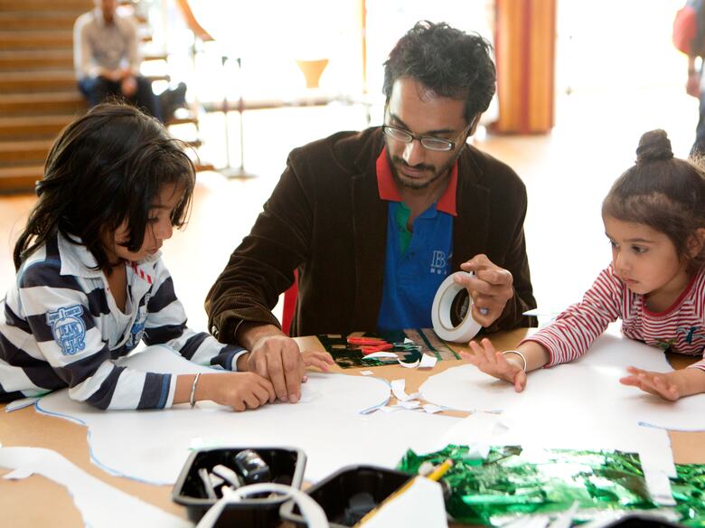 Father and children at a workshop