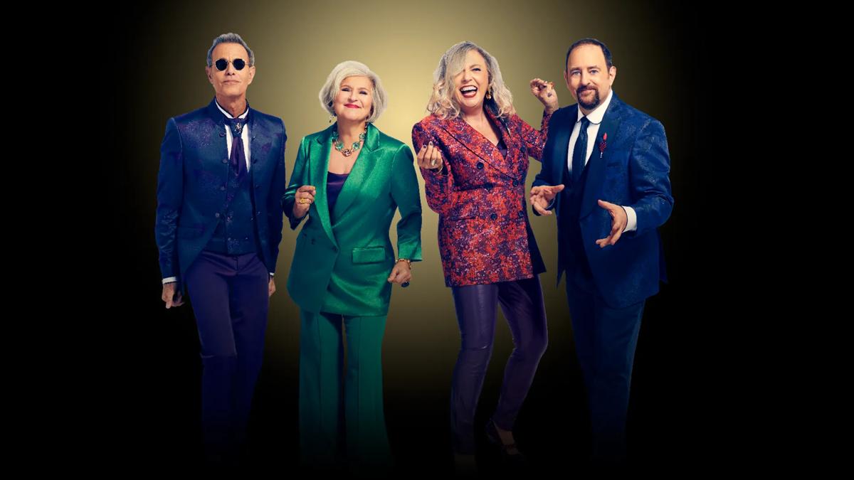 Manhattan Transfer vocal group posing together in front of a spotlight