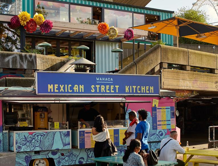Wahaca Food Truck with Restaurant in the background