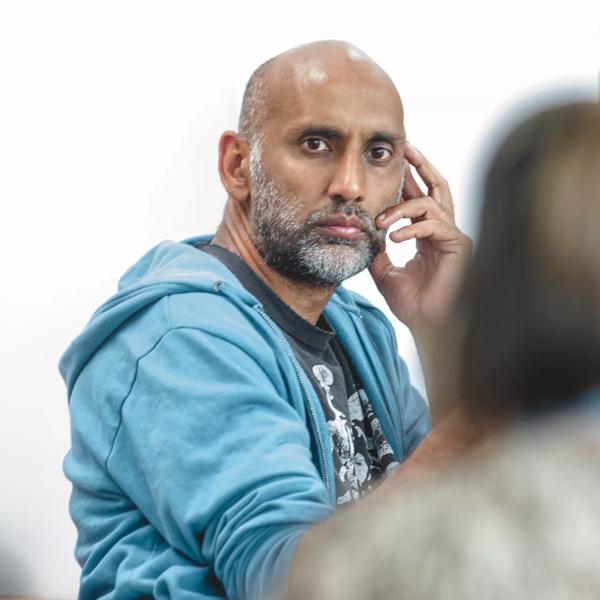 Ashish Ghadiali listens to another person speaking