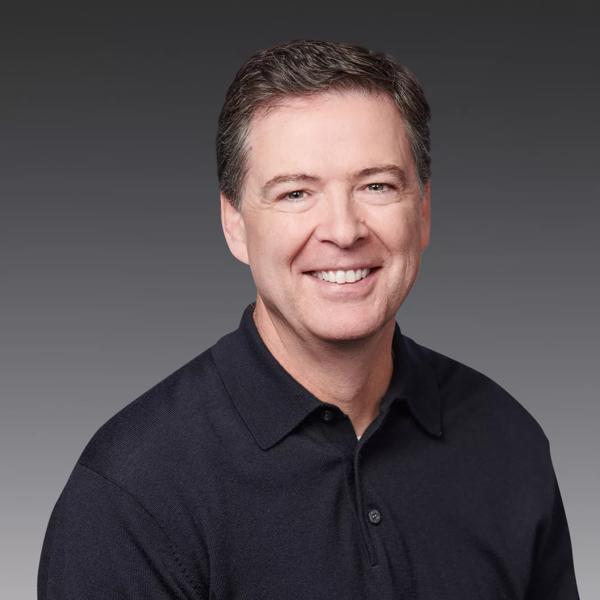Author James Comey wearing a black long sleeved shirt