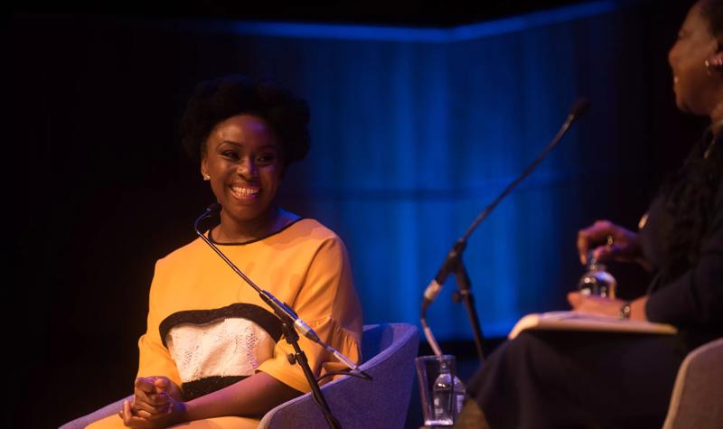 A photograph of author Chimamanda Ngozi Adichie on stage at Southbank Centre's WOW Festival