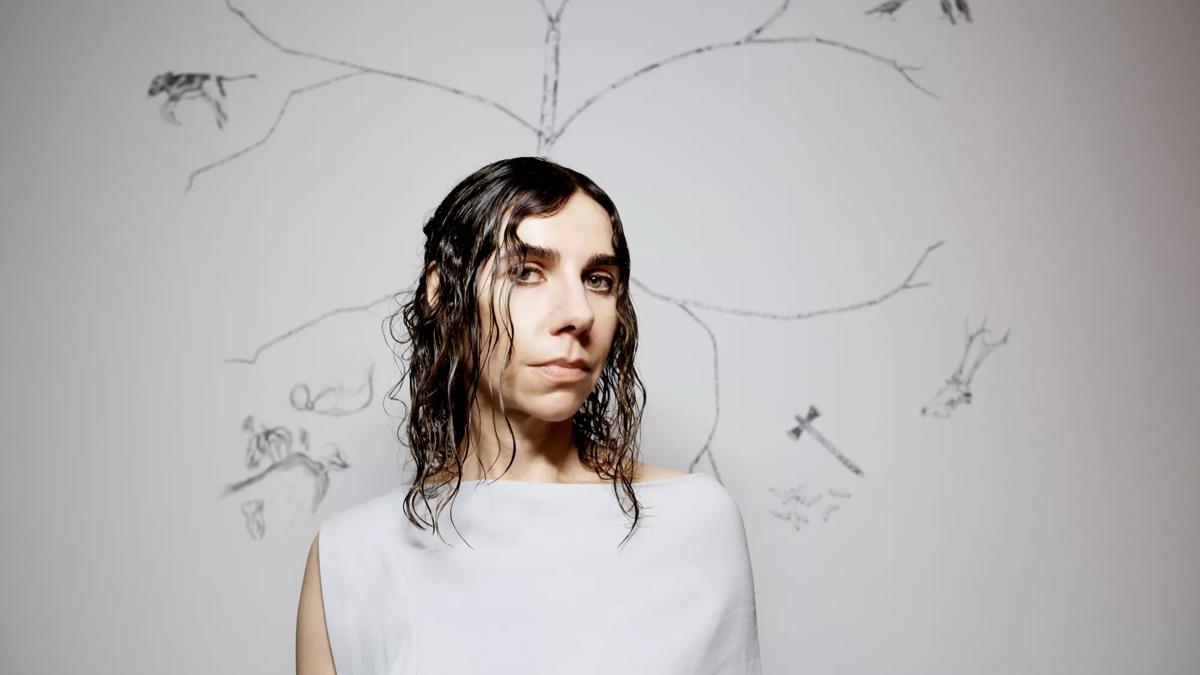 Portrait of PJ Harvey, wearing a white dress, in front of a sketch of a tree on a white background