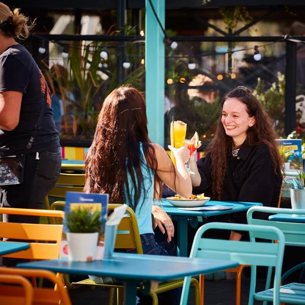 Las Iguanas Southbank outside seating with customers enjoying food and drinks