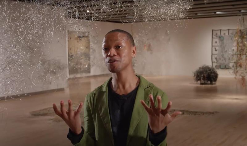 Nakhane talks expressively to camera within the exhibition Igshaan Adams: Kicking Dust at Hayward Gallery