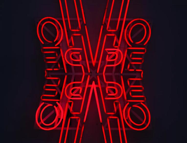 A red neon sign that says 'Hope'