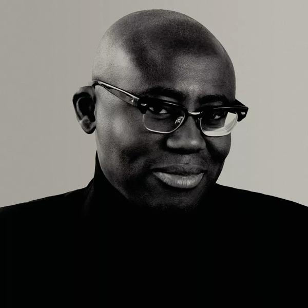 Edward Enninful, editor-in-chief of British Vogue and European editorial director of Condé Nast wears a black turtleneck and horn rimmed glasses