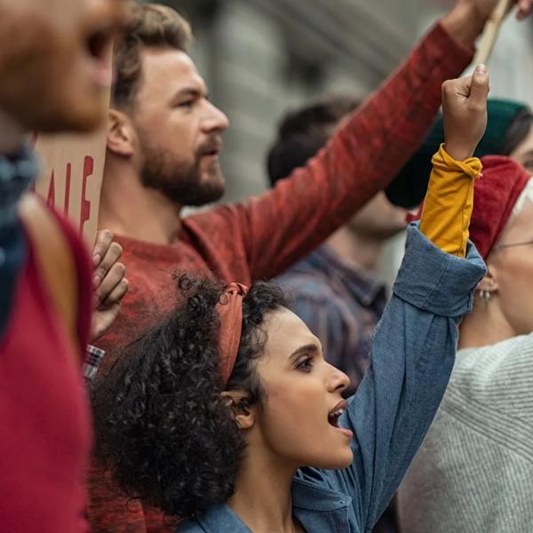 Protesters raising their arms.