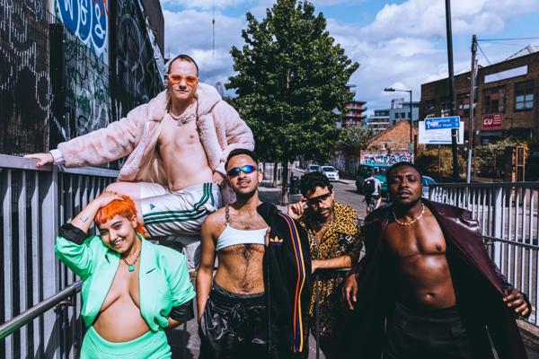 Photo of group Spice boys in front of a road in East London. 