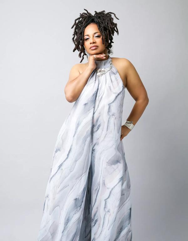 Artist Imaani wears a sculptural white dress