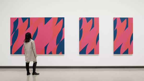 Installation view of Bridget Riley,  Red with Red Triptych, 2010 at Hayward Gallery 2019 © Bridget Riley 2019, Photo: Stephen White & Co