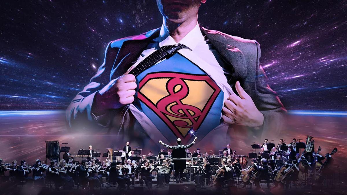 Orchestra playing in front of superman symbol