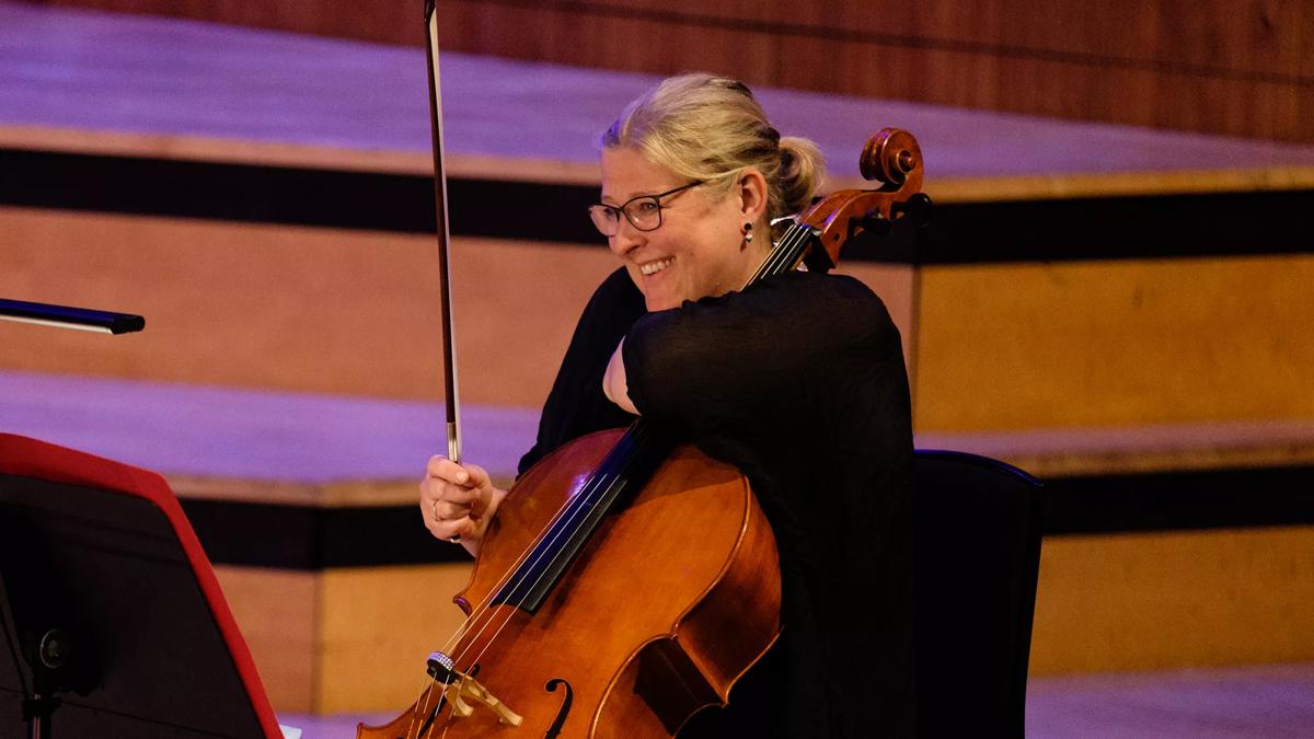 Karen Stephenson with a cello in the Royal Festival Hall