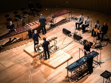 Percussionists on a wooden stage