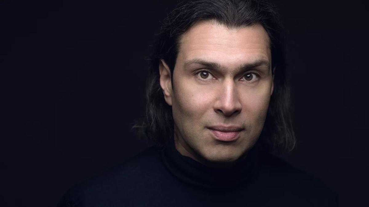 Vladimir Jurowski in from of a black background