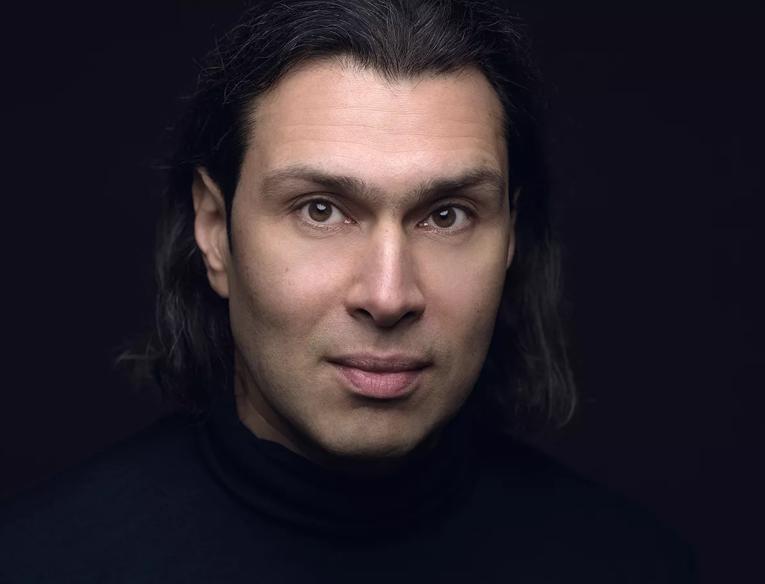 Vladimir Jurowski in from of a black background