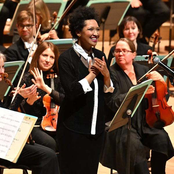 Julia Bullock in front of an orchestra