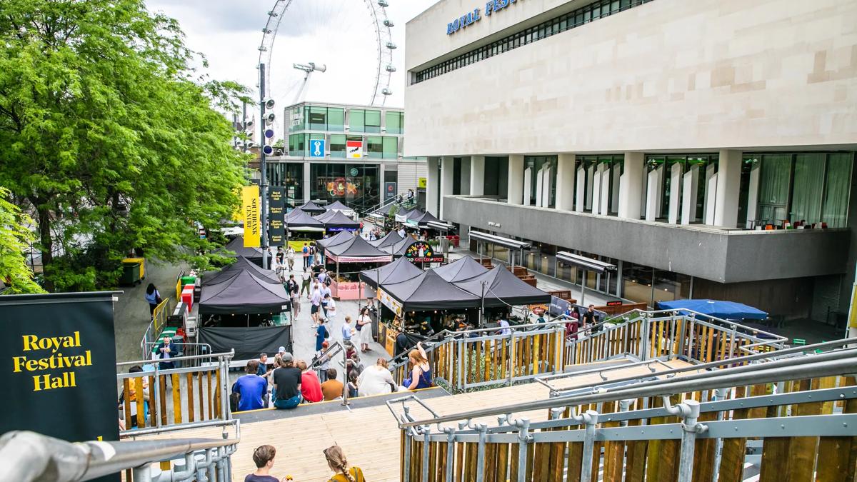 People enjoying the Southbank Centre Food Market