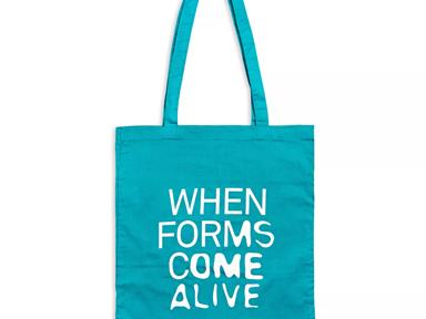 Photo of the blue tote bag with 'When Forms Come Alive' copy