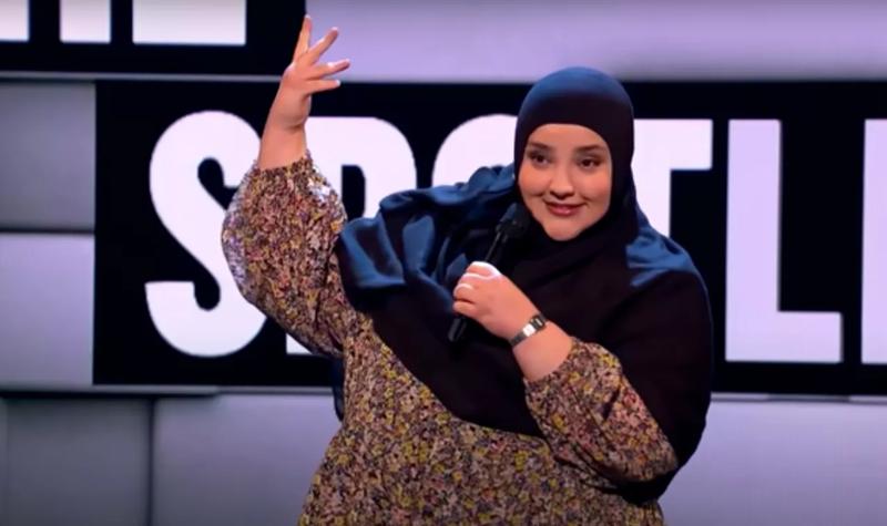 Comedian Fatiha El-Ghorri performs stand-up on stage