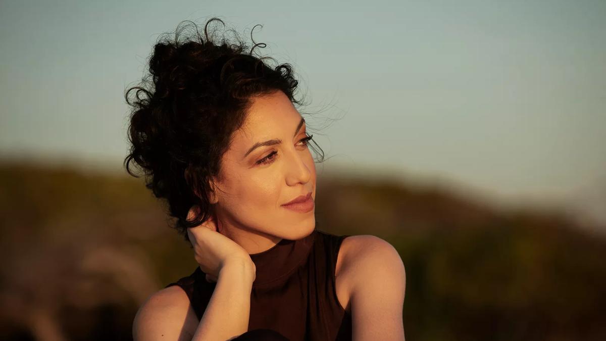 Pianist Beatrice Rana wearing a brown top on a field