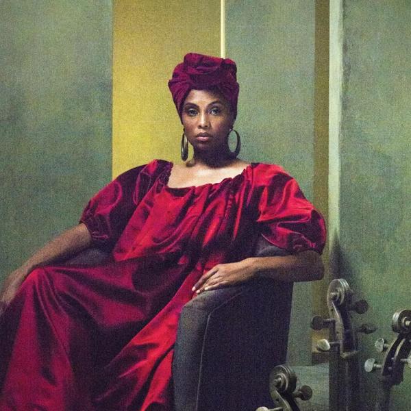 Imany - Voodoo Cello, woman sitting in a chair