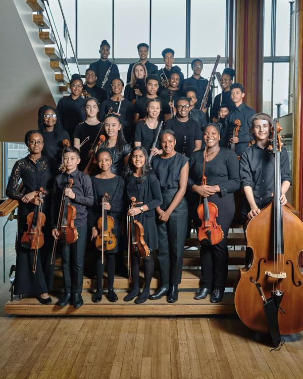 Chineke! Juniors, young musicians on staircase in Royal Festival Hall