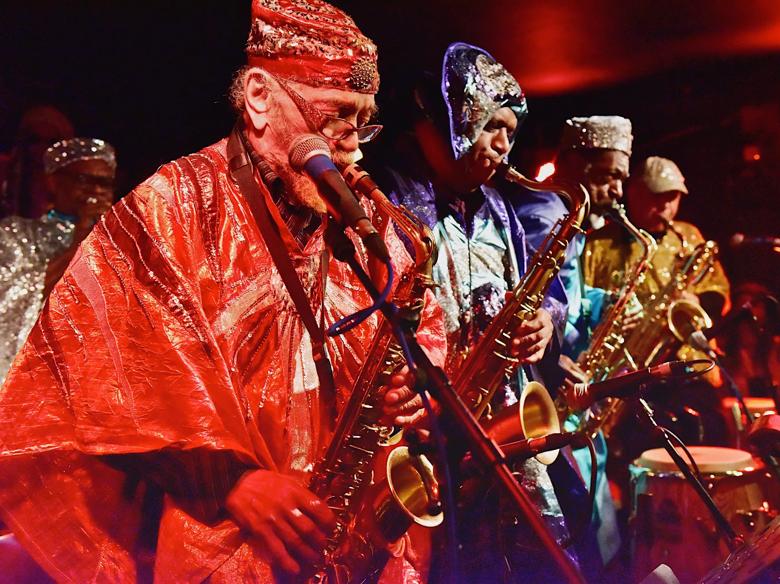 Sun Ra and band playing the saxophone 