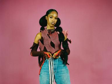 John Glacier, rapper, promo shot on a pink background