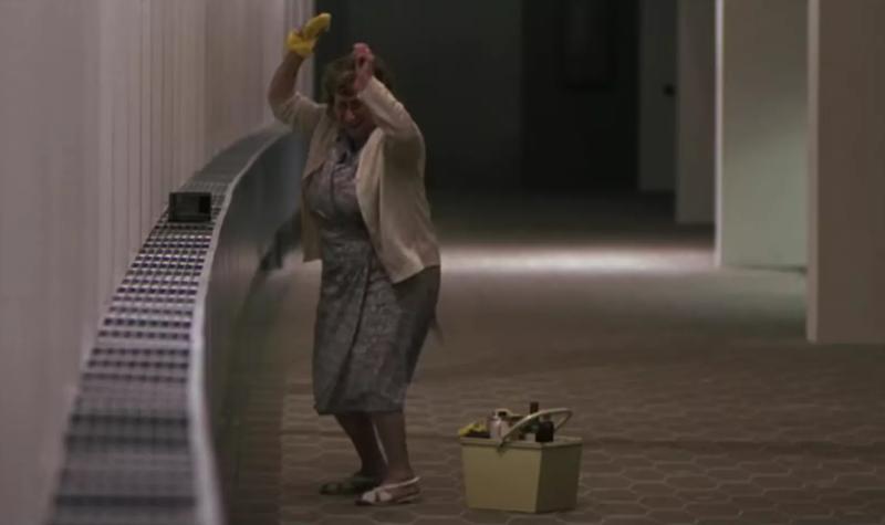 A cleaner dances in the Royal Festival Hall building in a scene from film The Boat That Rocked