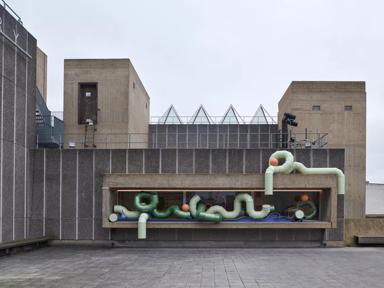 A sculpture made of green pipes on the roof of the Hayward Gallery