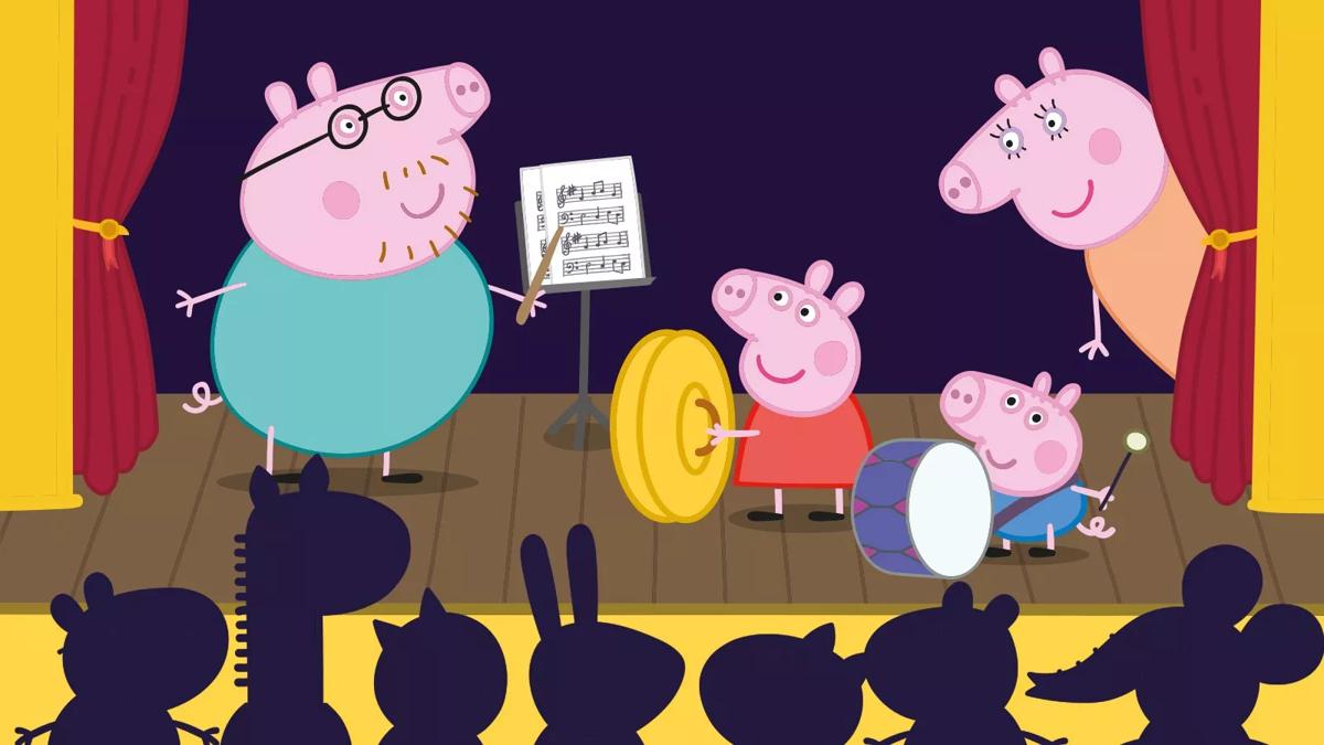 Peppa Pig and family performing on stage