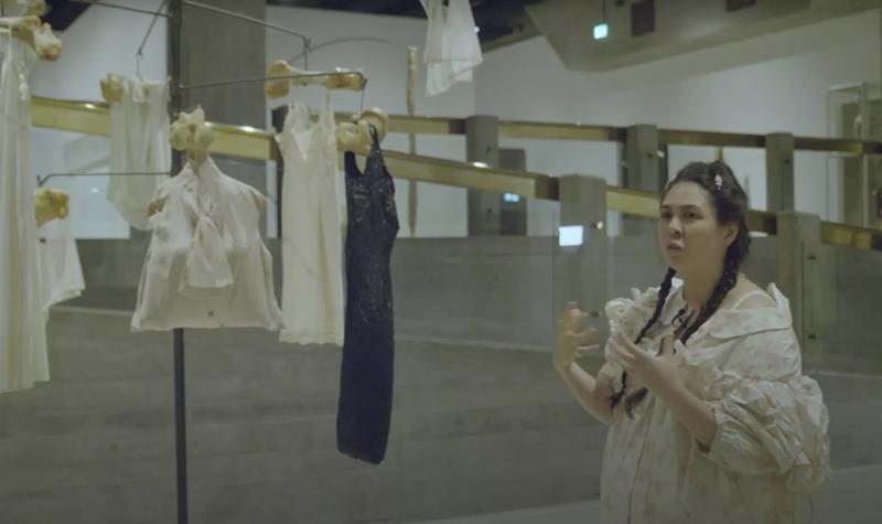 Simone Rocha stands in front of Louise Bouregois' art work Untitled (1996) within Hayward Gallery