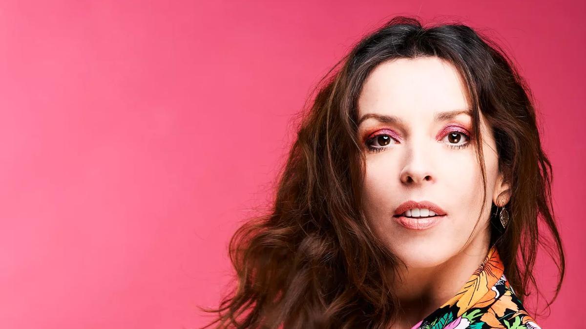 Portrait of Bridget Christie with a pink background, WOW