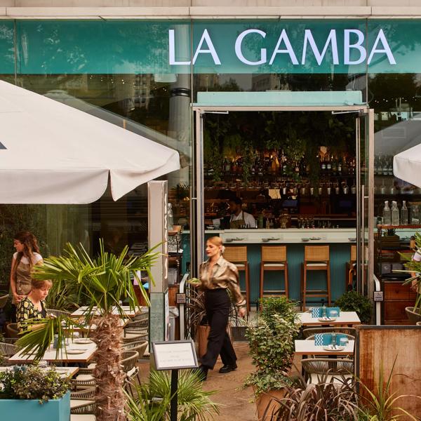 La Gamba exterior with outside seating and view into the restaurant