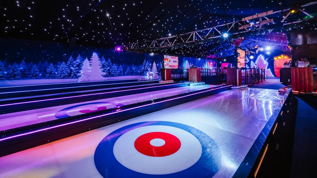 Curling club rink and room filled with people