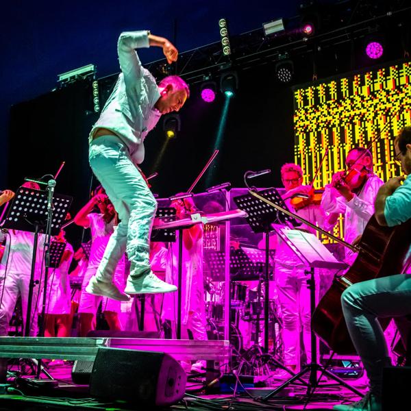 The Love Unlimited Synth Orchestra performing on stage
