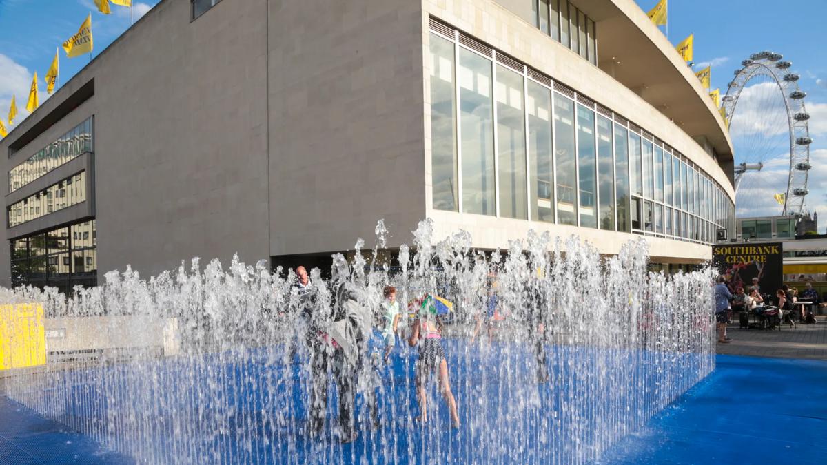 People enjoying the Jeppe Hein Fountain