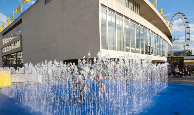 People enjoying the Jeppe Hein Fountain