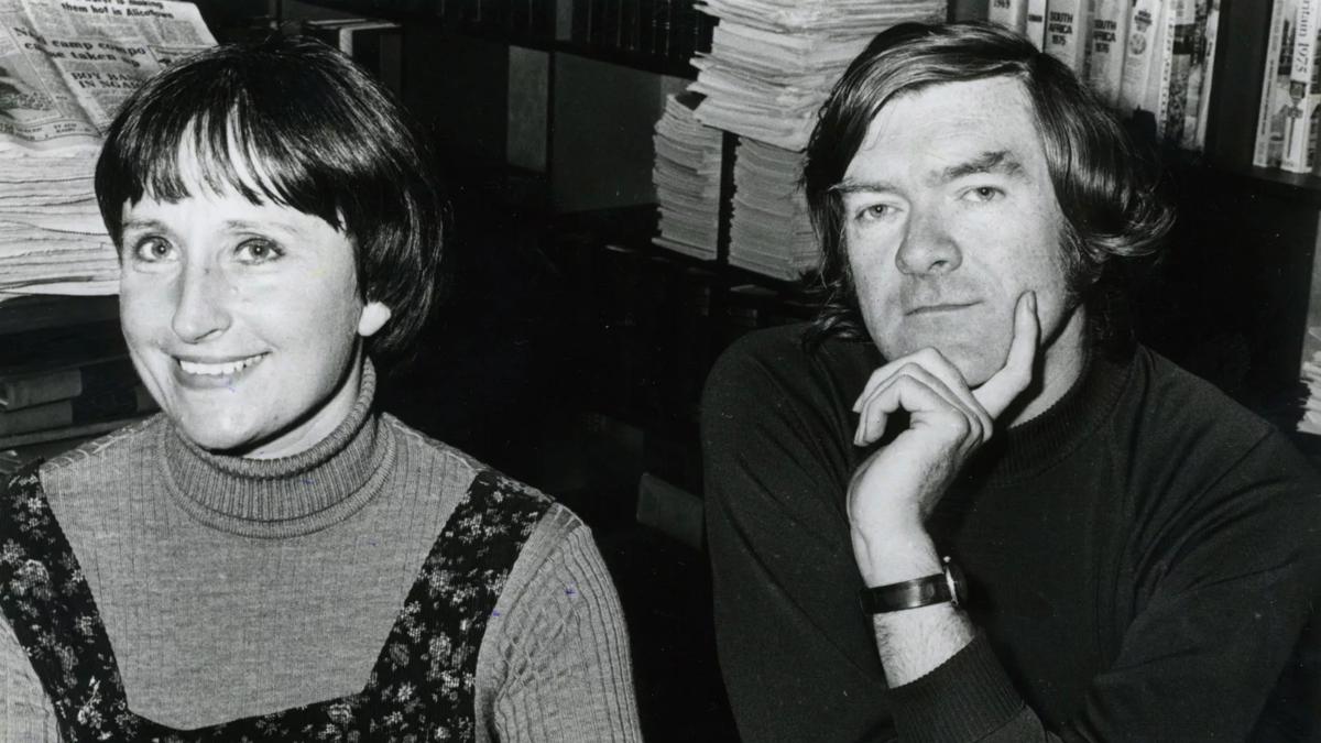 Soprano Jane Manning and composer Anthony Payne sitting together in a room full of books