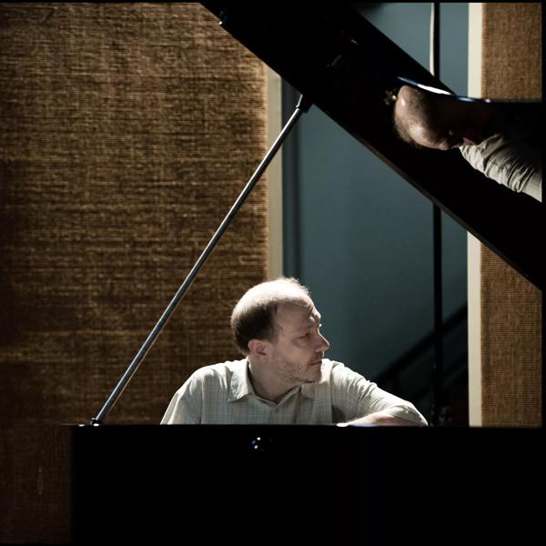 Pianist Marc-Andre Hamelin in a studio with an open grand piano