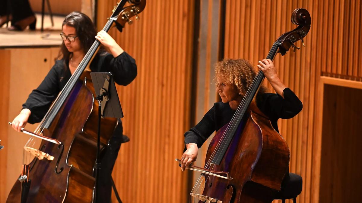 Chi-chi Nwanoku and fellow female double bassist playing their instruments