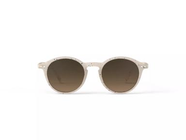 A pair of ceramic beige sunglasses with brown lenses