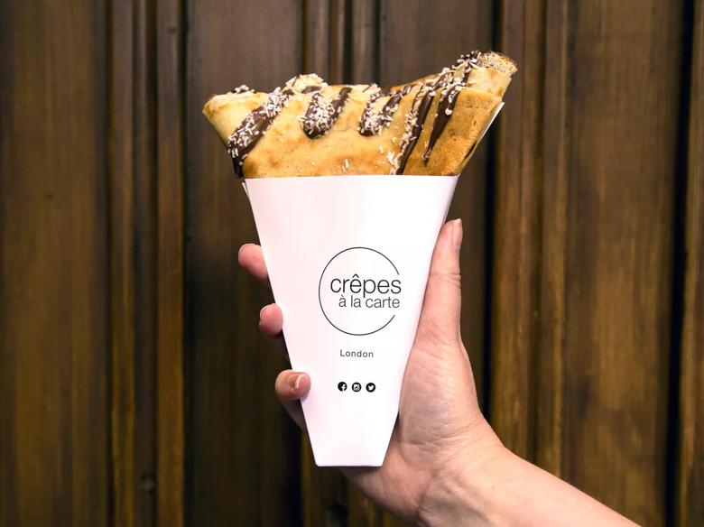 Photo of a banana and nutella crêpe in a takeaway cone served by Crêpes à la carte at Southbank Centre Food Market