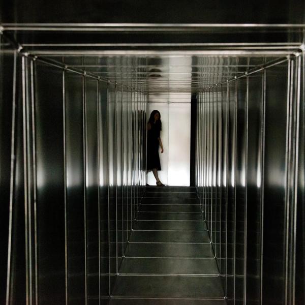 Girl at end of Metal Corridor installation by Carsten Höller in Hayward Gallery  