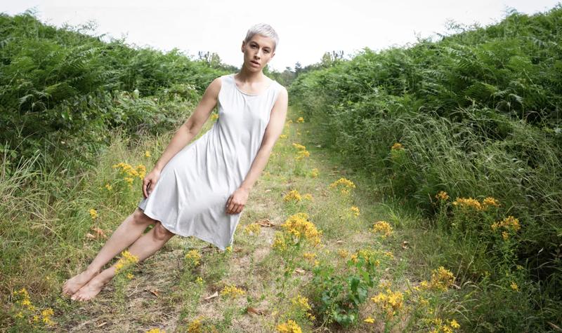 Unseen: Photographer Suzie Larke expresses inner struggle. Photo of Suzie swaying sideways in a field