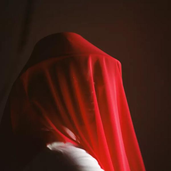 Artist Sonny Nwachukwu in a red veil